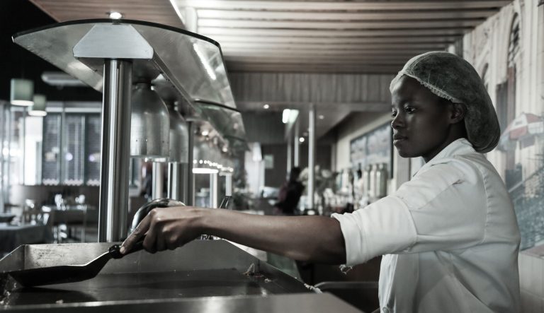 Experienced chef preparing meals in a commercial kitchen in Kempton Park, South Africa.