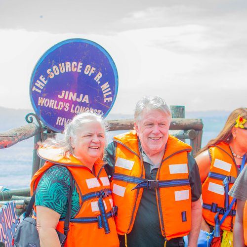 Tourists wearing life vests pose at the Source of the Nile in Jinja, Uganda.