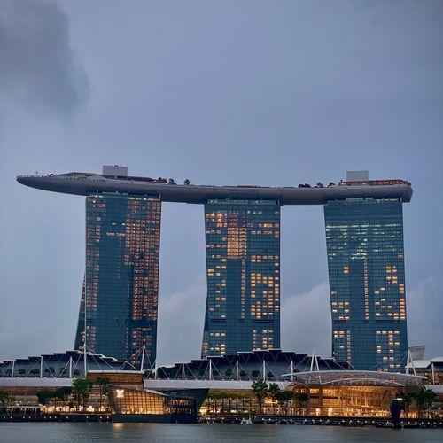 Dramatic view of Marina Bay Sands, Singapore's iconic skyline at dusk.