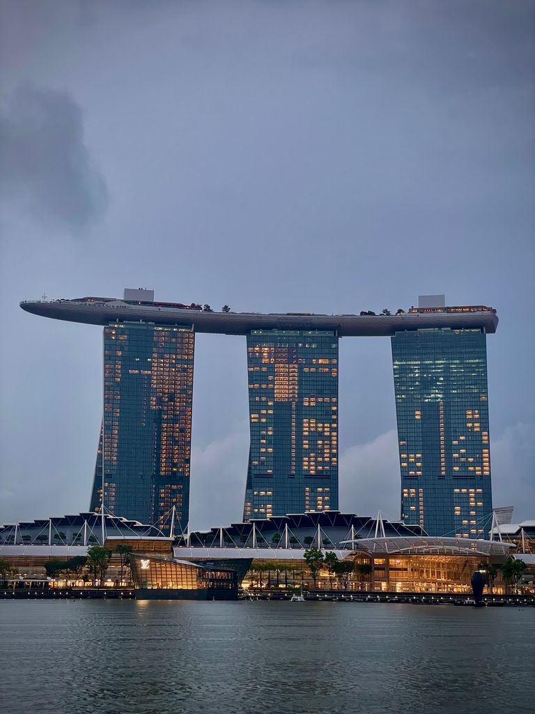 Dramatic view of Marina Bay Sands, Singapore's iconic skyline at dusk.