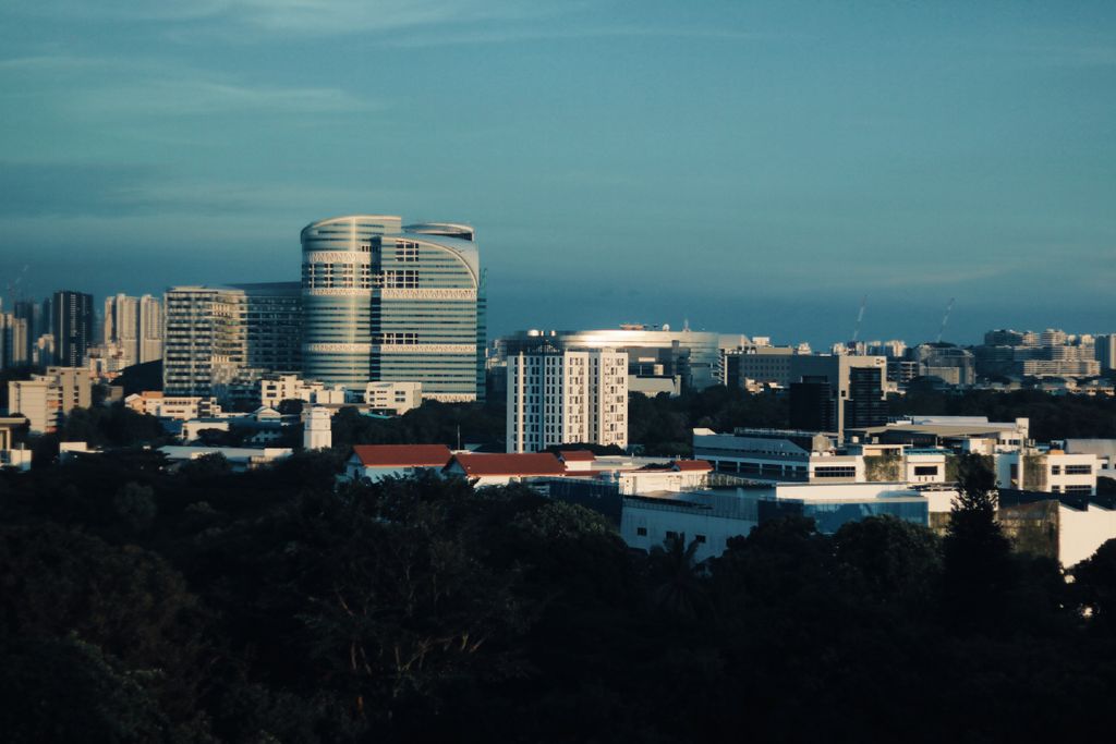 Skyline of Singapore featuring modern architecture under a clear blue sky.